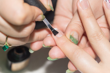 Obraz na płótnie Canvas professional manicure in a beauty salon