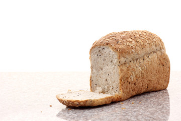 whole wheat bread sliced on marble table