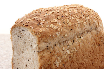 whole wheat bread sliced on marble table