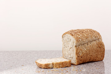whole wheat bread sliced on marble table