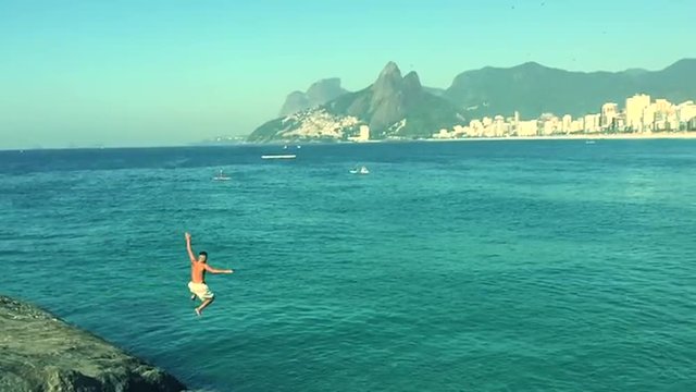 Brazilian Jumping into the Sea at Arpoador Rio