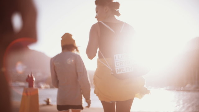 Grunge girls walking and talking together outdoors