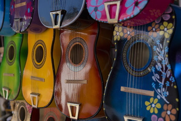 Row of Colorful Guitars on Display