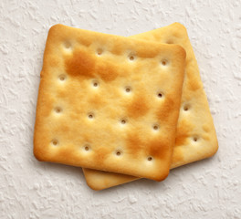Two dry cracker cookies
