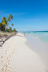 Young Girl Walking beaches of Tulum. Caribbean Paradise,