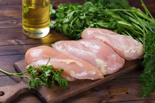 Raw  chicken meat  on wooden table