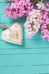 Background with fresh flowers hyacinths and heart