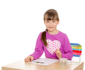 The girl draws the table