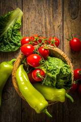bunch of vegetables in the wooden bowl