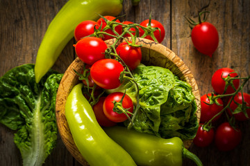 bunch of vegetables in the wooden bowl