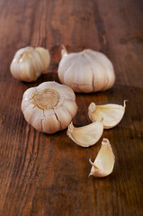 Organic garlic  on a wooden background.