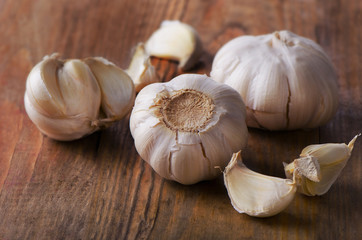 Organic garlic  on a old wooden background.