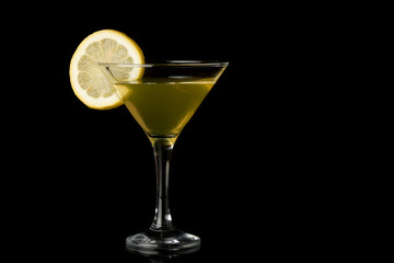 Lemon martini on black background