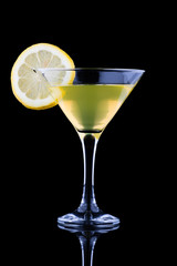 Lemon martini on black background