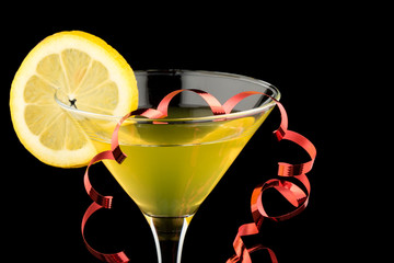 Lemon martini with red streamer