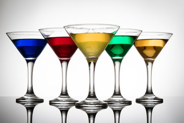 color cocktails in martini glasses