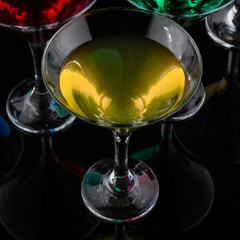close up color cocktail in martini glass