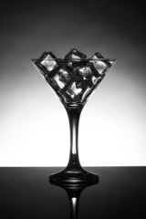 Martini glass filled with ice cubes