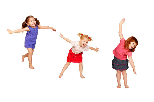 Happy dancing kids. Isolated on white