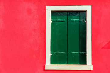Colorful window of a house on the Venetian island of Burano