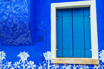 Colorful window of a house on the Venetian island of Burano