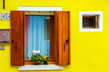 Colorful window of a house on the Venetian island of Burano