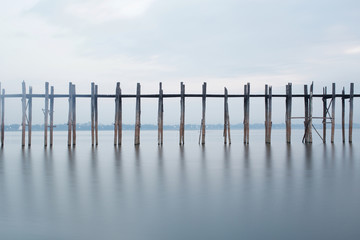 U Bien Bridge in the fog at sunrise, Amarapura, Myanmar