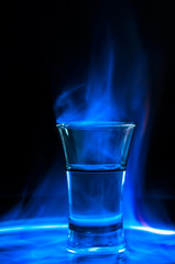 Glass with flaming coctail