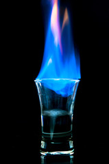 Flaming drink on black backdrop