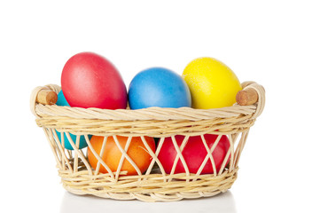 Easter eggs in basket on white background