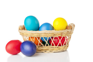 Colorful eggs in basket