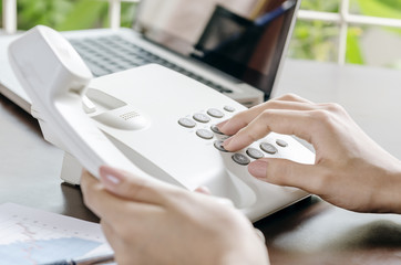 woman making a phone call in office