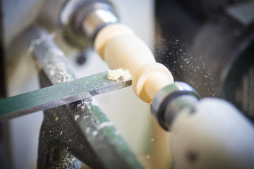 hand with a chisel in the course of the woodwork