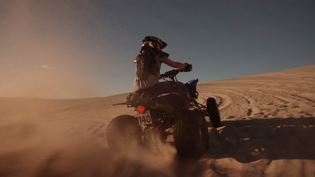 Quad bike with excellent tyre tread going uphill