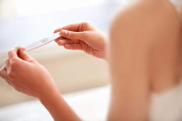 Woman Holding Pregnancy Test - obrazy, fototapety, plakaty