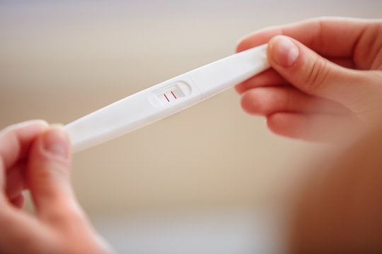 Woman Holding Pregnancy Test