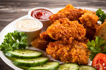 Fried chicken nuggets and vegetables
