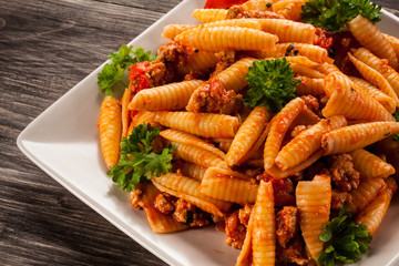 Pasta with meat, tomato sauce and vegetables