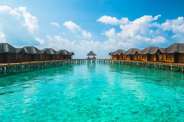 Over water bungalows with steps into amazing green lagoon