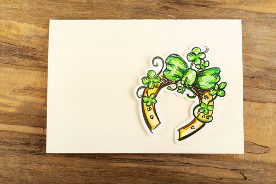 Greeting card for Saint Patrick's Day with horseshoe