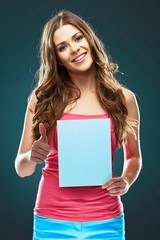 young woman smile, show thumb up, holding white blank board.
