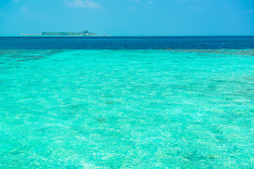 Fototapeta na wymiar Sand beach and ocean wave, South Male Atoll. Maldives