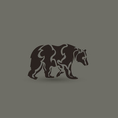 Artistic vector silhouette of a bear. Creative idea.