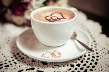 Coffee with wedding rings