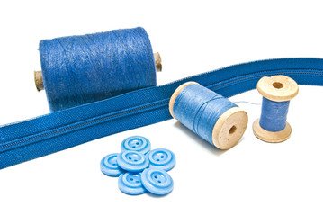 spools of blue thread and buttons