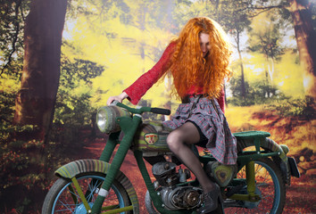 Redhead girl on motorbike
