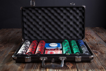 Suitcase with poker cards and chips