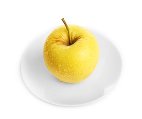 Apple on saucer isolated on white