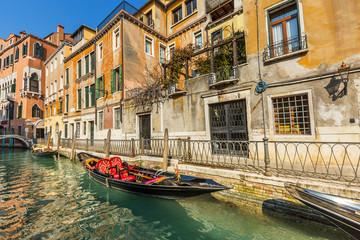 Fototapeta na wymiar Lovely canal with gondola in Venice