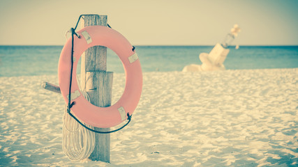 Life preserver on sandy beach